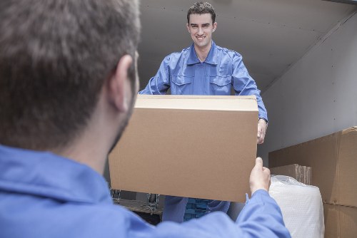 Removal and storage service planning in Nineelms with moving boxes and packed furniture